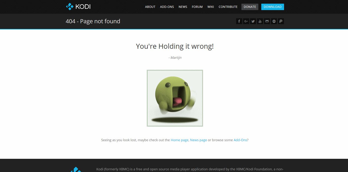 Página de erro 404 da Kodi mostrando um pequeno emoji verde muito frustrado.