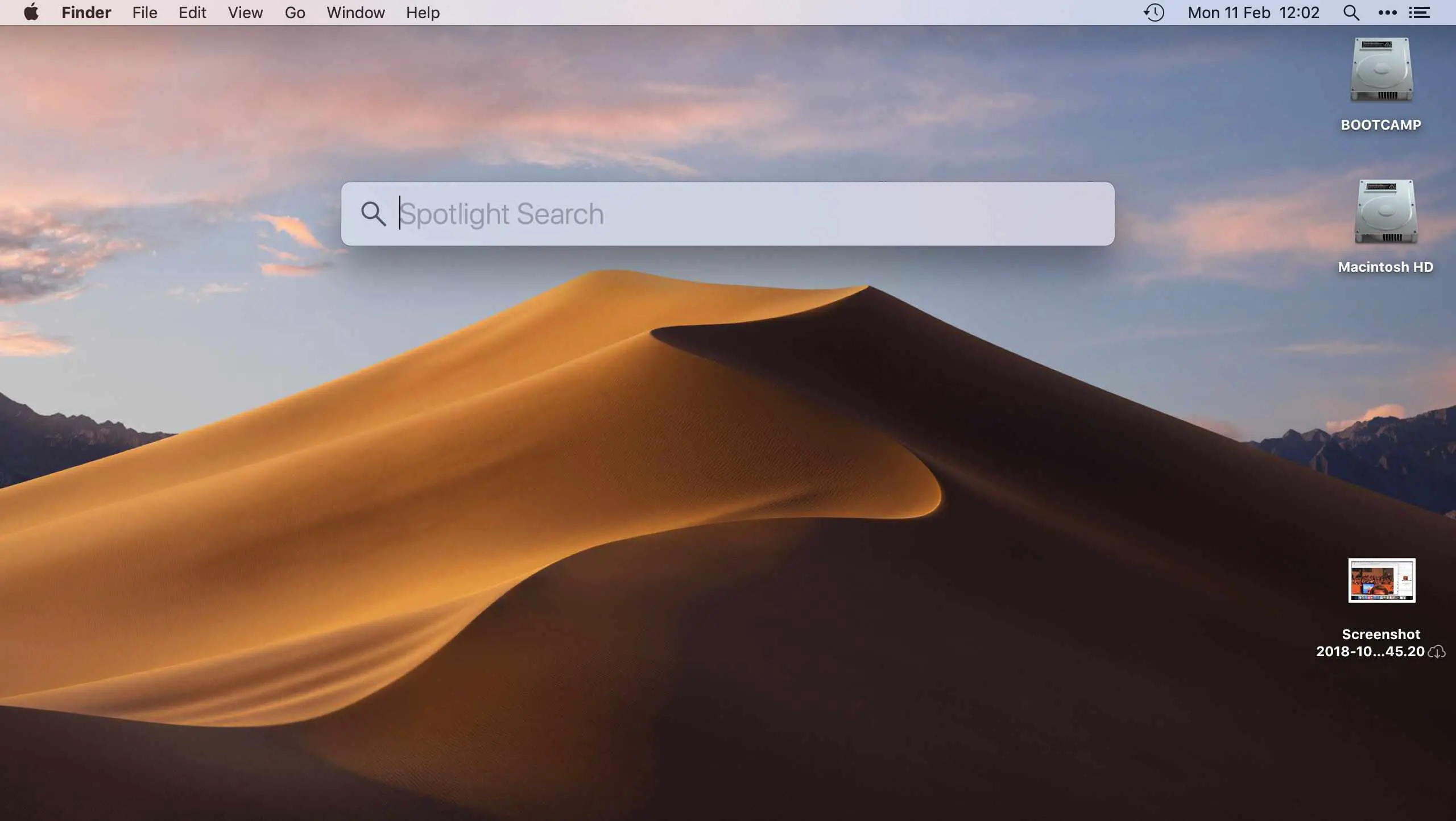 Área de trabalho do Mac mostrando a barra de pesquisa do Spotlight