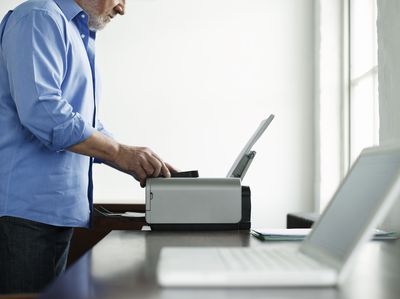 Man messing with printer