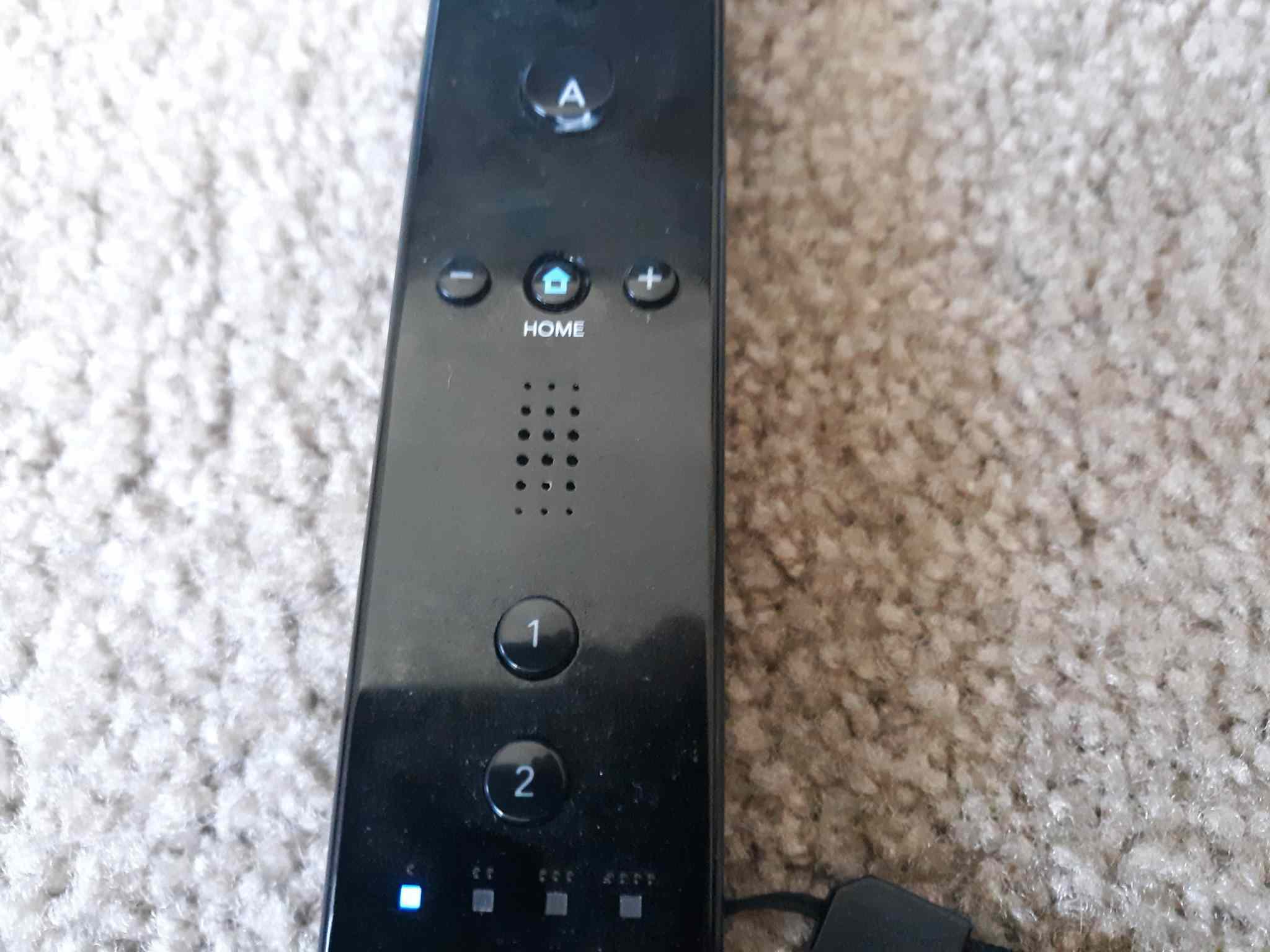 O botão Home no controlador do Wii